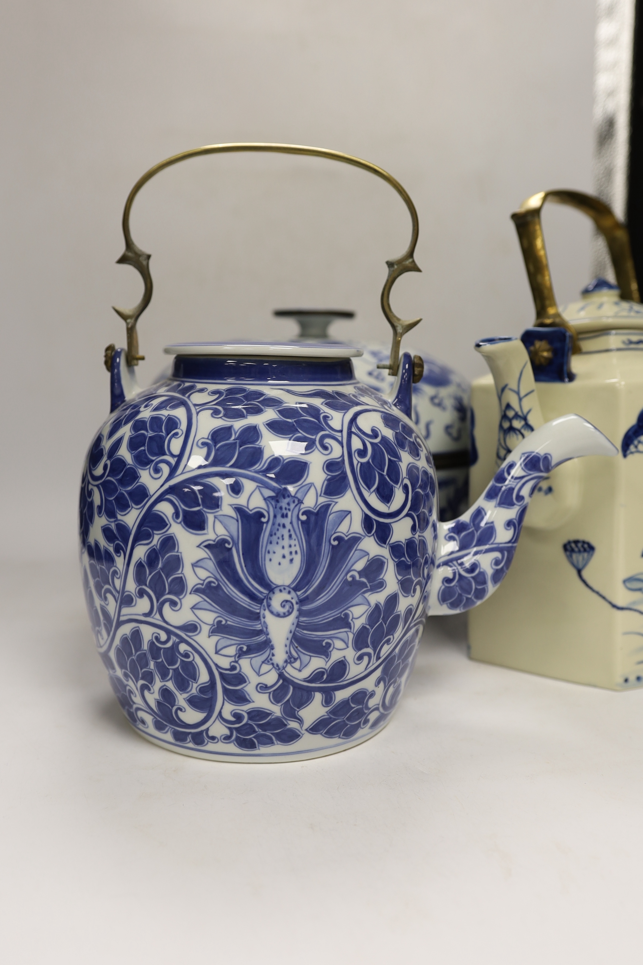 Four modern Chinese blue and white ceramic items; two teapots, a lidded vessel and a bowl, tallest 23.5cm